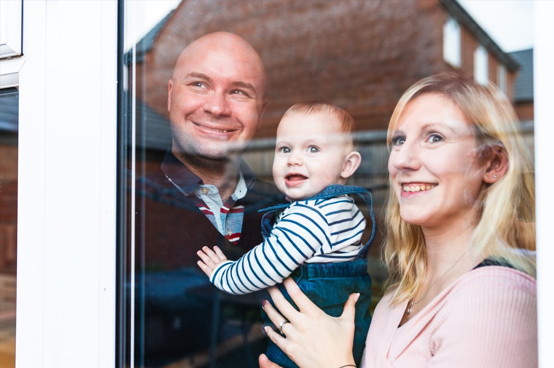 Family looking out Window